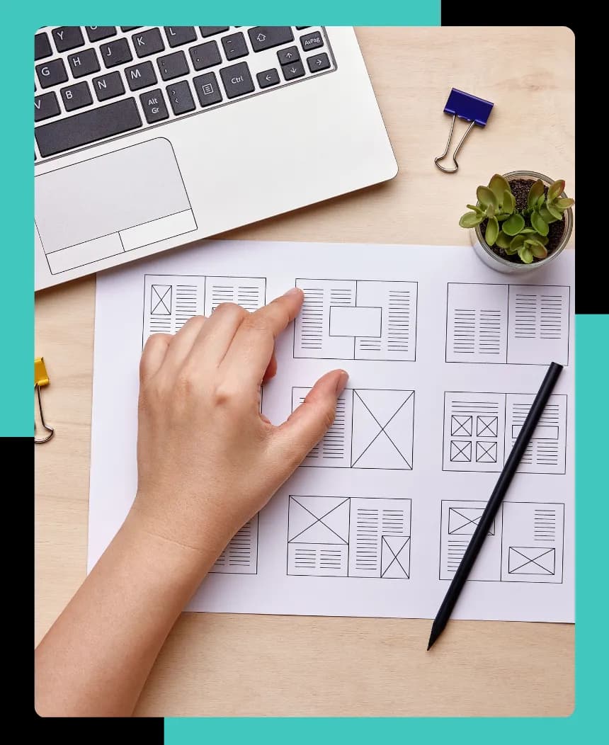 A hand over a layout design