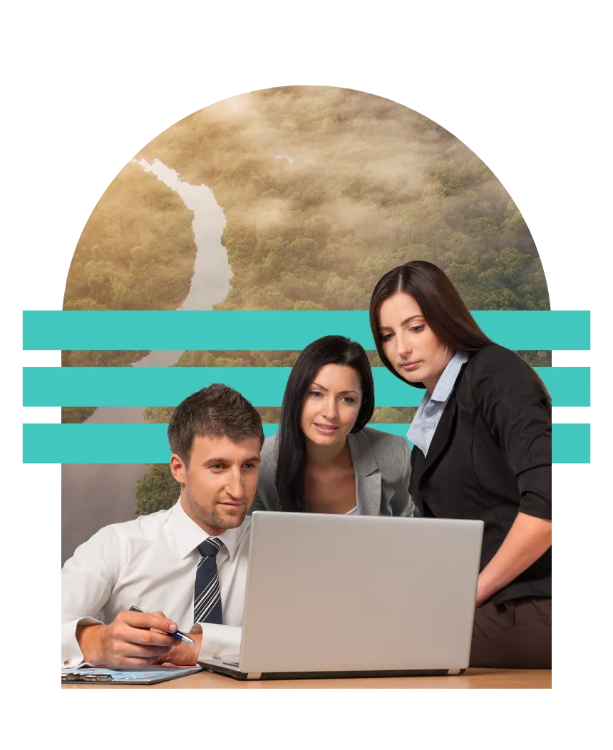 Three people working around a laptop