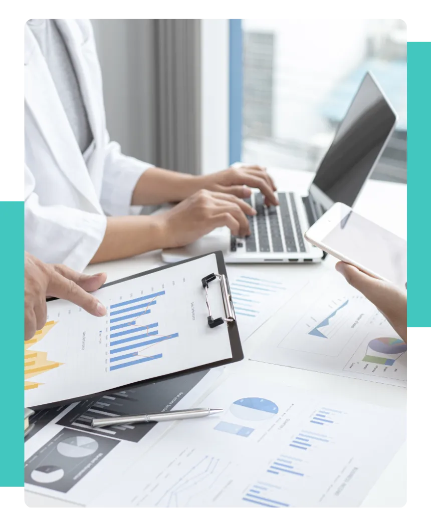 A close-up and faceless shot of of people going through data and information